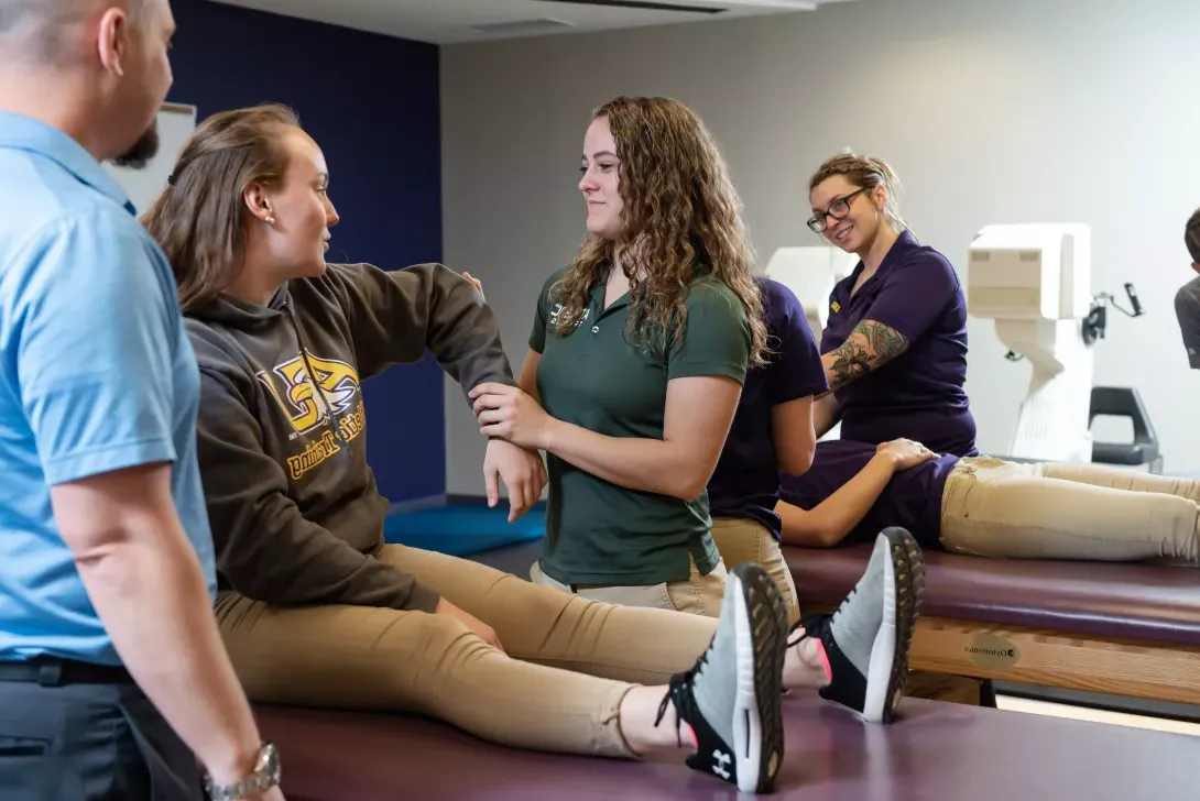 Athletic Training student practices working with a patient